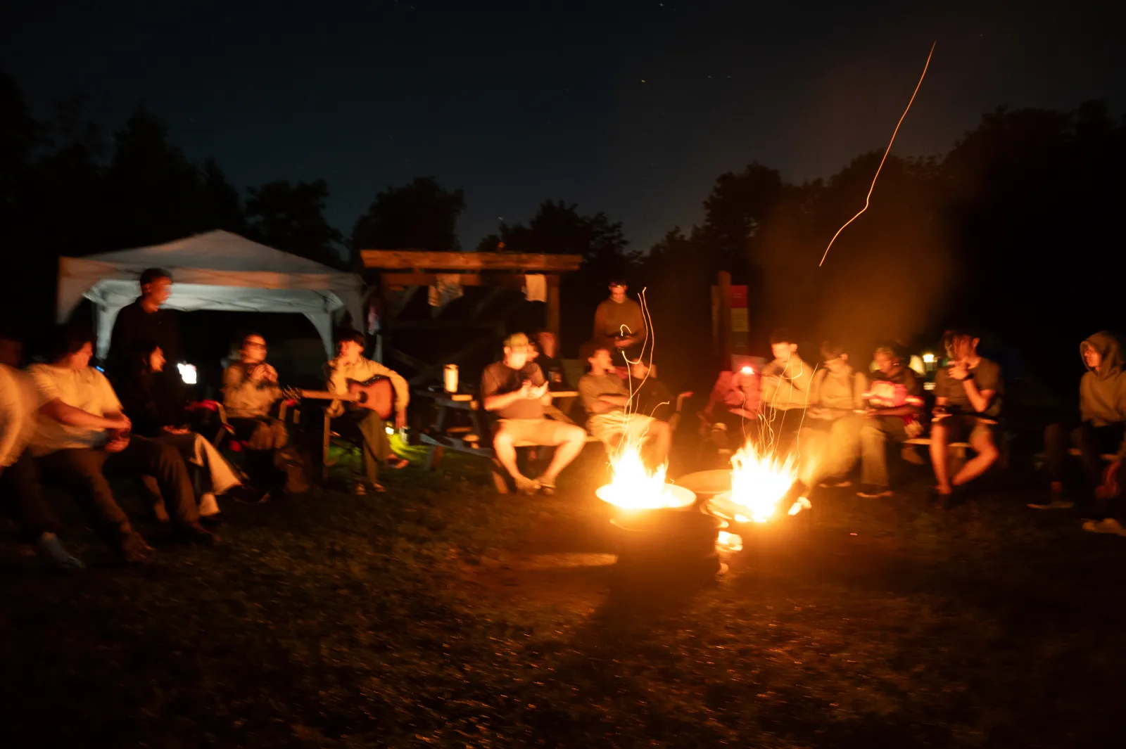 Sitting around a campfire at Shad